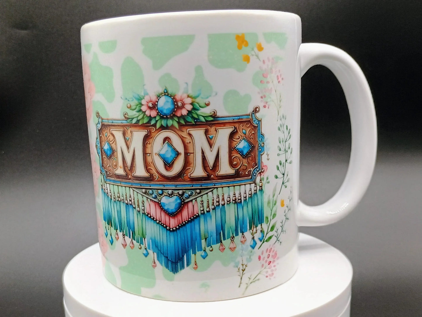 White ceramic mug with colorful boho-style MOM design and floral accents