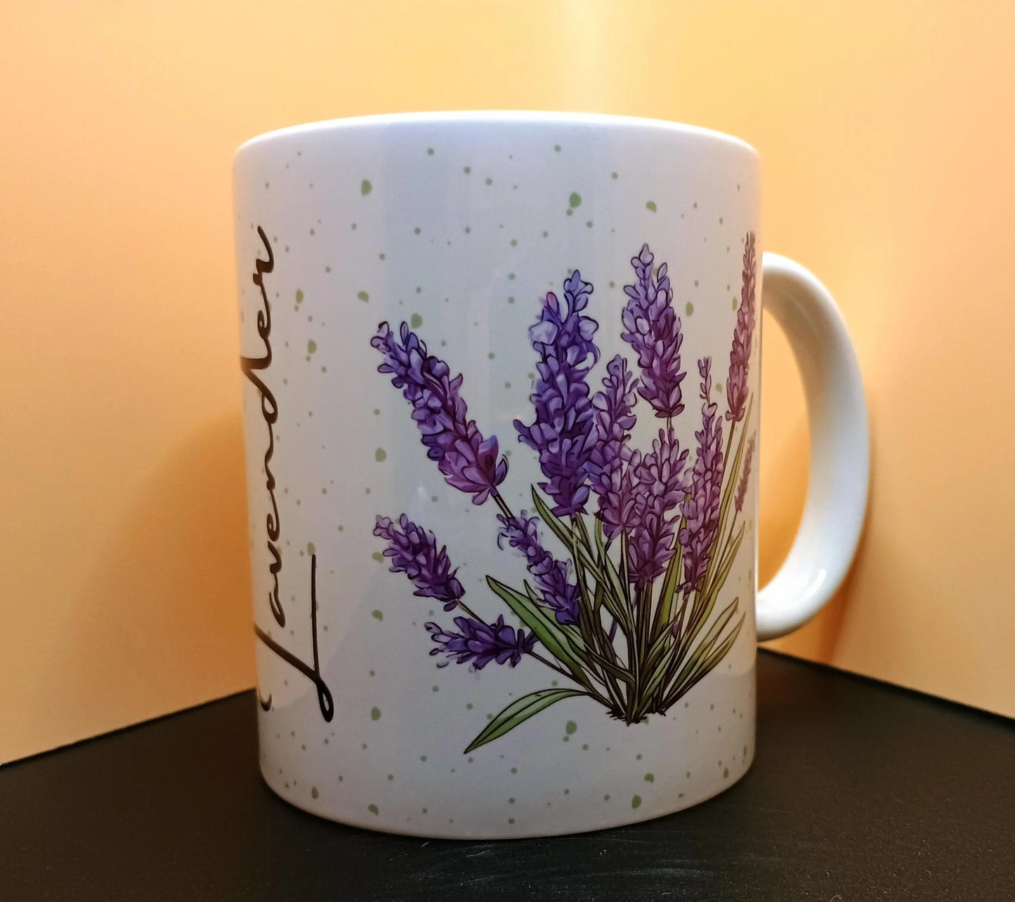White mug with watercolor lavender flowers and ‘Lavender’ text against warm background