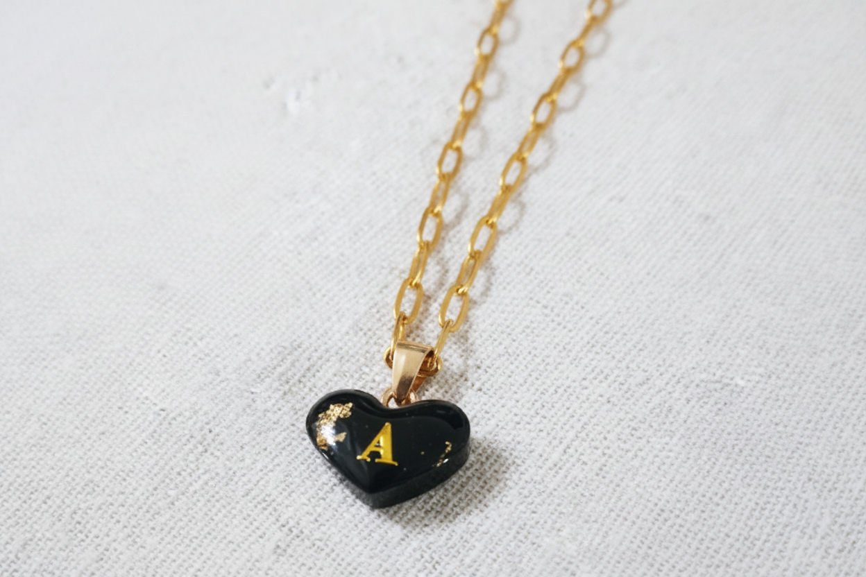 Silver bead bracelet with green wooden heart charm on handmade jewelry card