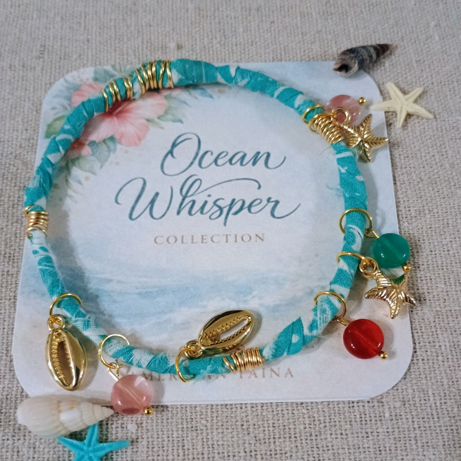 Turquoise beaded bracelet with charms on a 'Ocean Whisper' collection card.