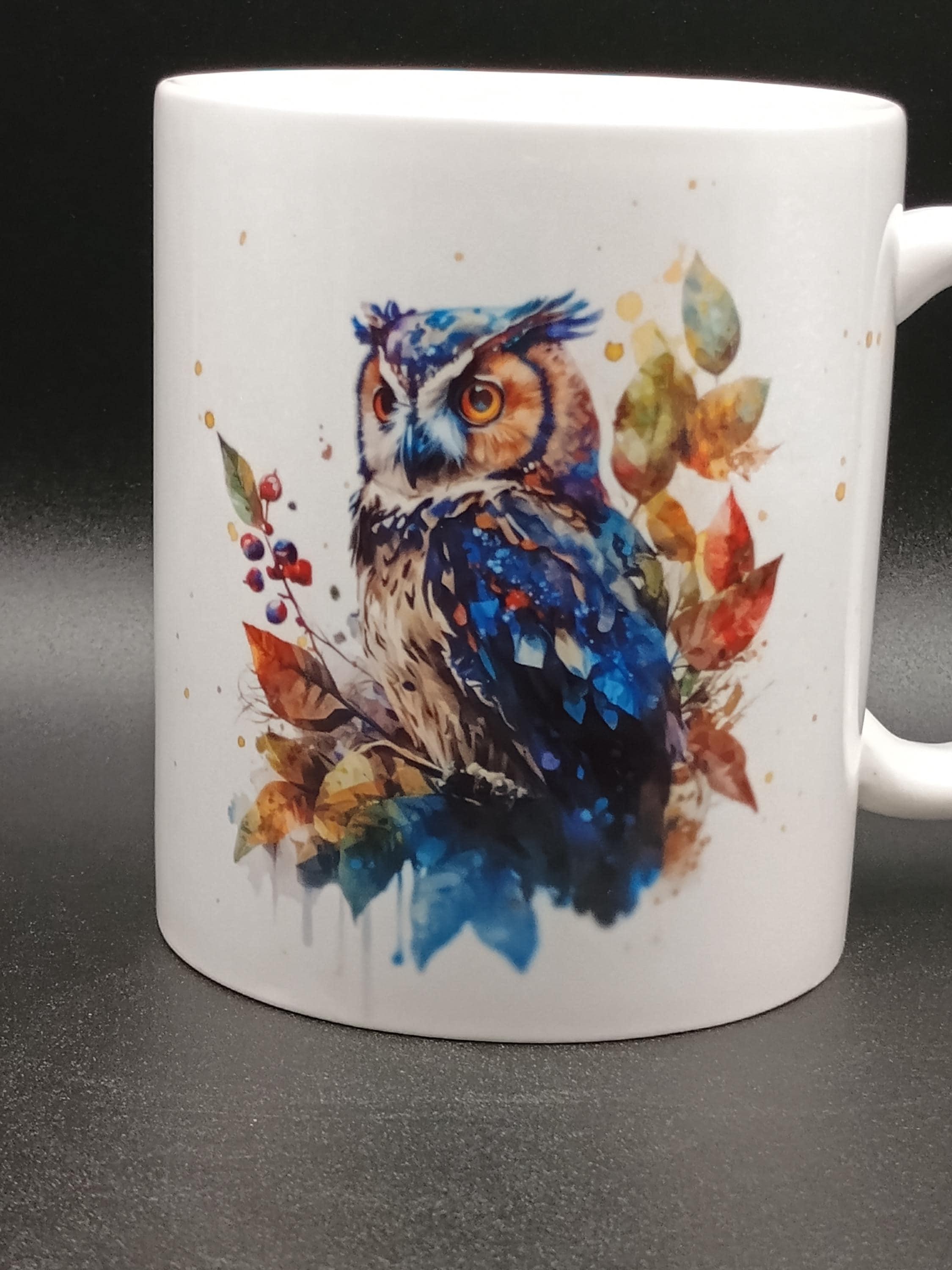 White ceramic mug with watercolor-style owl and autumn leaves design